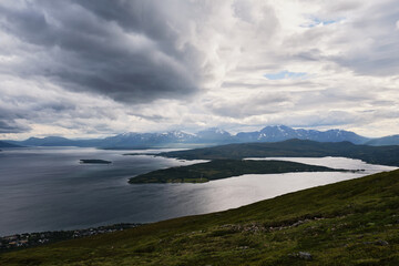 Scenic view of clouds and mountains over the sea from the top of a mountain in Norway