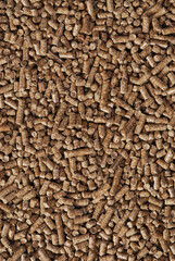 Wood pellets - close-up, background, cheap energy.