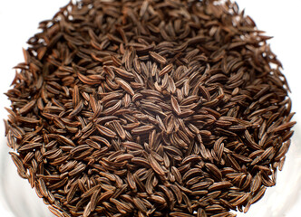 Bowls with spices and ingredients on dark background.