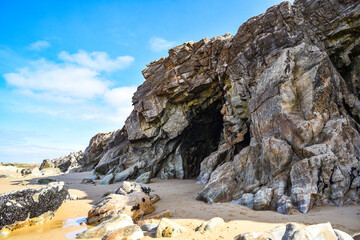 Cave on the ocean coast in France, rocky coast landscape.