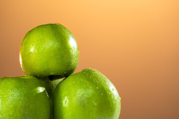 close-up of apples lying on the table against the sunset background. apple juice