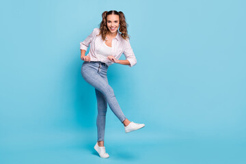 Full length body size photo of girl with tails dancing kicking at party isolated vivid blue color background