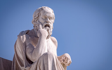 Socrates the ancient Greek philosopher and thinker white marble statue under blue sky, space for your text