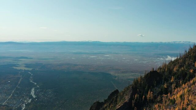 Eastern Sayans in autumn. Tunka valley in the early morning.