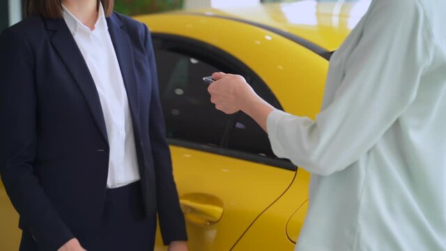 Buy car, sales manager woman sell automotive, give key to buyer and do handshake close up. Spbas