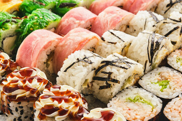 Japanese sushi food. Maki ands rolls with tuna, salmon, shrimp, crab and avocado. Assorted sushi