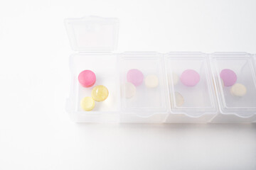 A weekly dosage of medication in pill dispenser