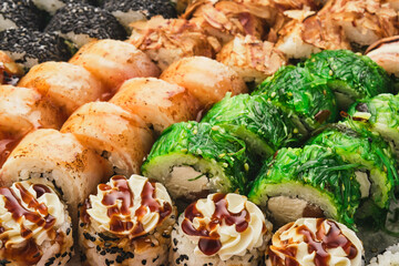 Assortment Sushi Roll Set, top view, close-up. Hosomaki, uramaki, gunkan.