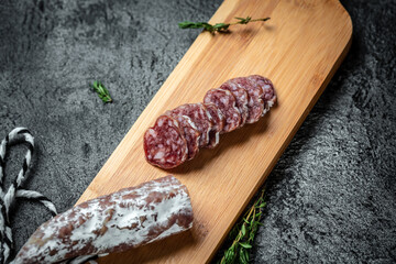 Fuets Catalan dry sausages. Set of spanish sausages and dry cured meat chistorra, chorizo, salchichon, fuet on background. top view