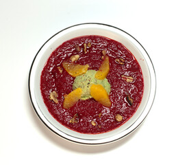 soup in a plate close-up on a light background.