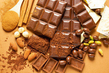 White and milk chocolates. Almond, pistachio, hazelnut.. background, texture..