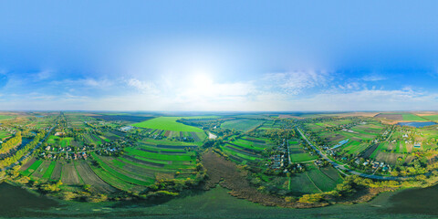 Colorful spherical Aerial 360-degree panorama over the countryside. Beautiful bright landscape...