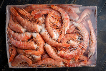Large frozen headless langoustine prawns in a package. 