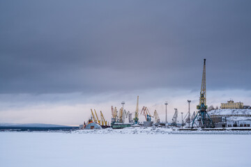 Snow-covered and frozen port, located in Murmansk, Russia.