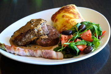 Dish with grilled pork and grilled biff with mashed potatoes and vegetables