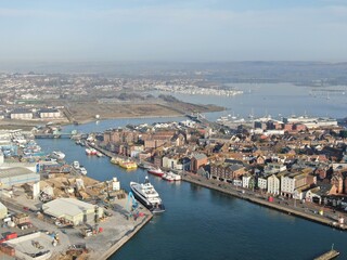 Obraz premium aerial view of Poole harbour and the historic Quay area seen on a sunny calm morning