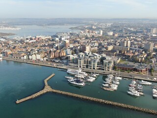 Fototapeta na wymiar aerial view of Poole harbour and the historic Quay area seen on a sunny calm morning