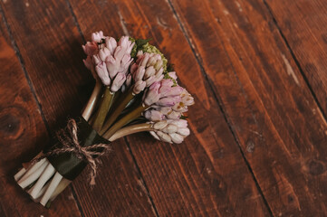 bunch of pink flowers on wooden background 