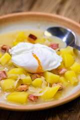 Czech traditional cabbage soup with smoked meat and potatoes