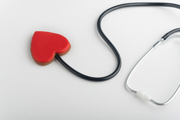 Stethoscope and red heart. Follow your heart. White background