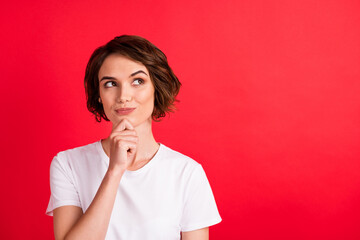 Portrait of attractive curious girl thinking copy empty space clue isolated over bright red color background
