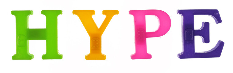 The word hype is lined with multicolored plastic letters isolated on white background.