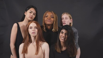 Diverse models in studio, interracial friendship and good relationships, bodypositive concept, isolated black background.