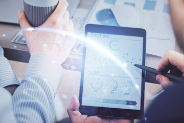 Double exposure of man's hands holding and using a phone and social network theme drawing.