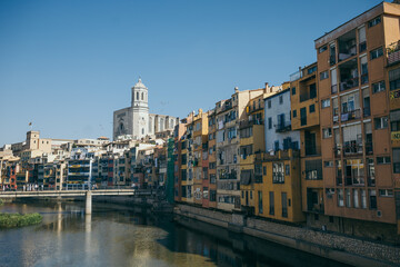 A bridge over water with a city in the background