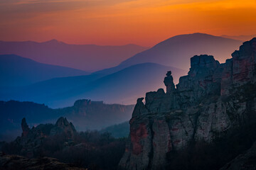 Warm sunset sky over the beautiful silhouettes of Belogradchik rocks 