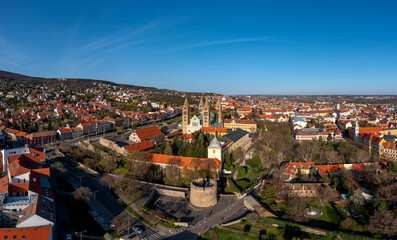 Fototapeta na wymiar Amazing aerial cityscape about the Pecs city historical downtown and basilica in springtime. Unique medieval mood city in Hungary