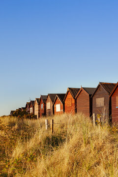 Beach huts at dusk Studland beach, Dorset