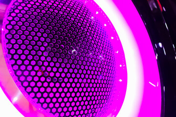 speaker with pink LED lights background