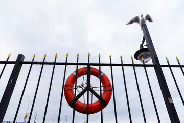 Turkey. Istanbul. The fence on the pier. A lifebuoy on the fence of the passenger port.