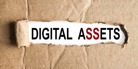 Digital Assets. text on white paper over torn paper background.