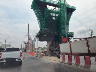 The construction of an elevated bridge to tackle the problem of traffic jams. Rama 2 Road, Bangkok, Thailand.