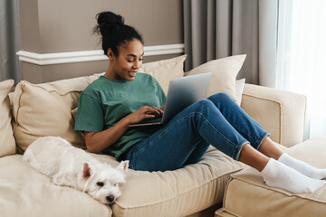 beautiful young woman working with laptop at home