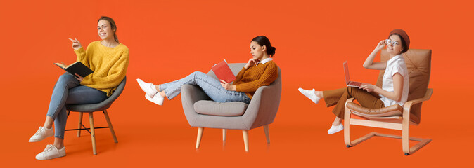 Beautiful young woman reading book while sitting in armchair on color background