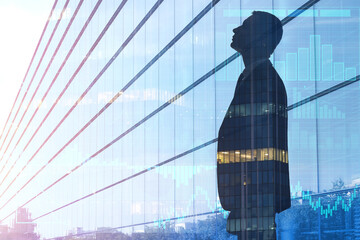 Fototapeta premium Double exposure of young businessman and modern building