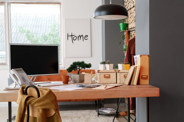 Comfortable workplace of fashion designer with modern computer in office