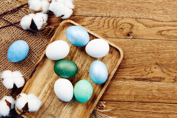 Fototapeta na wymiar colorful eggs wooden board easter holidays decoration