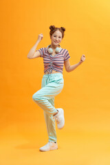 Fototapeta na wymiar Young asian woman jumping celebrating victory