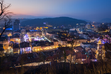 Fototapeta na wymiar Ljubljana city in the evening, Slovenia. Elevated view of old European city light