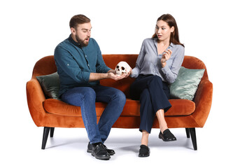 Young couple trying to read their future on white background