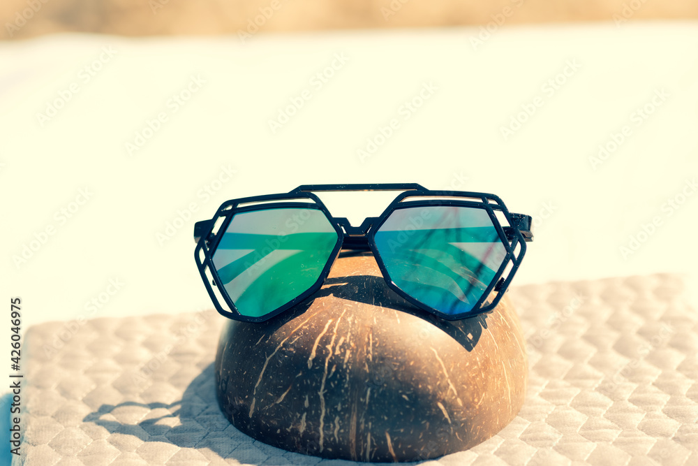 Wall mural Futuristic sunglasses design with big green lenses closeup shoot outside in a summer day . Selective focus. High quality photo