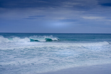 Fototapeta na wymiar Surfing the waves of France