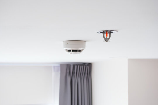 Water sprinkler and Smoke detectors sensor, Automatic fire extinguishing systems on white background with copy space, Installed inside the buildings to prevent fire for safety of life and property.