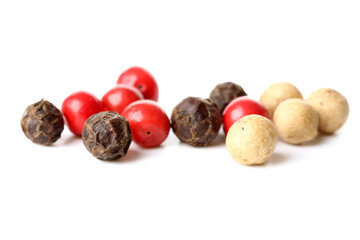 Mixed peppercorns on white background