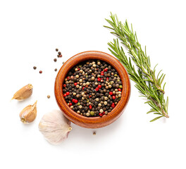 Bowl with mixed peppercorns, garlic and rosemary on white background