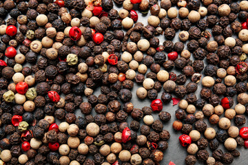 Mixed peppercorns as background, closeup